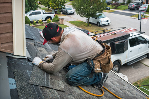 Professional Roofing technician working in Queenstown, MD